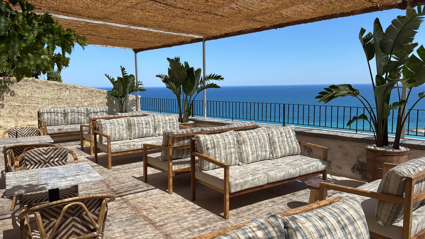 Lounge seating in the shade overlooking the Mediterranean on the Bar Lounge Las Torres terrace