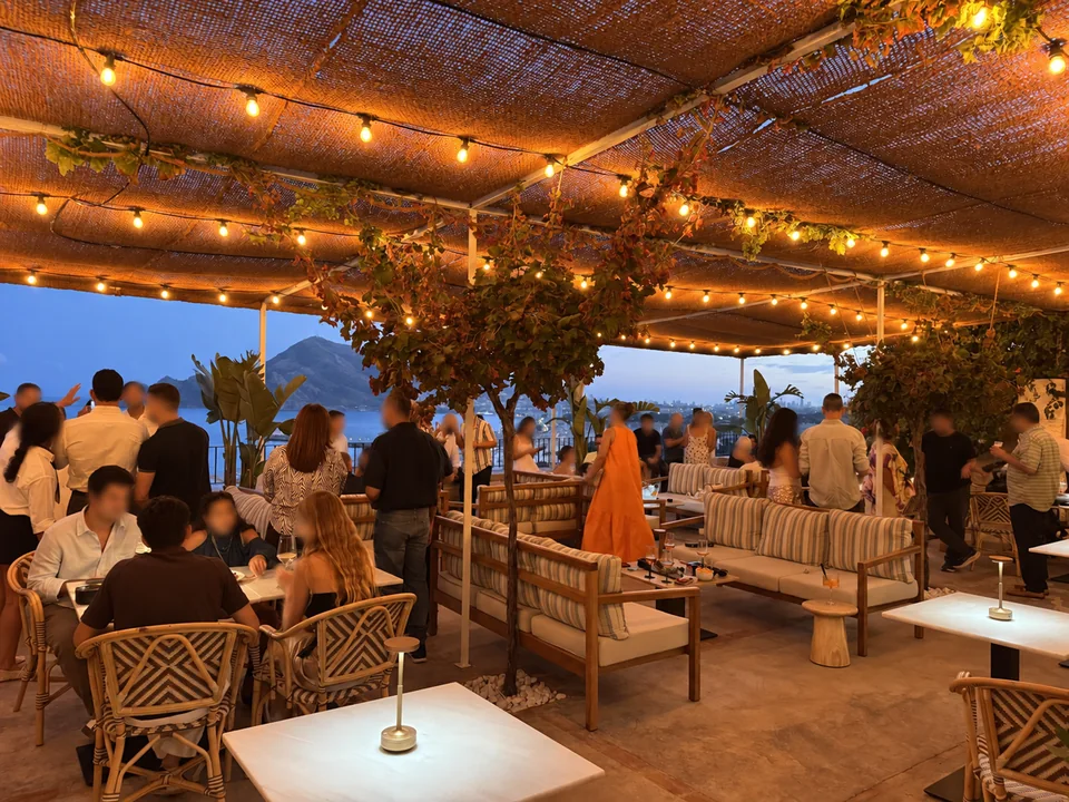Guests celebrating on the sea-view terrace at Bar Lounge Las Torres