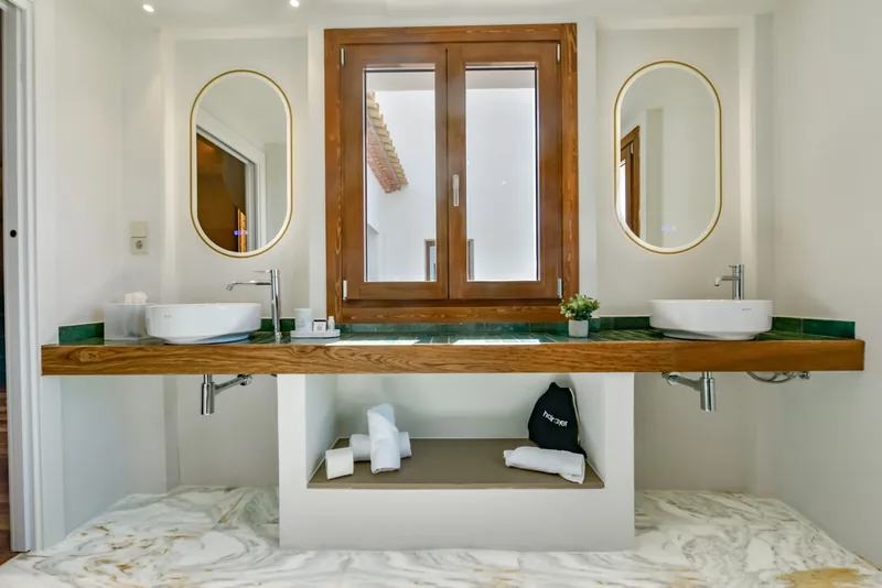 Double washbasin and illuminated mirrors in the Suite bathroom at Las Torres