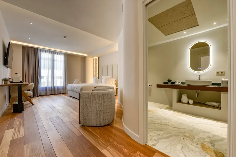 Suite interior showing the bedroom and bathroom at Las Torres
